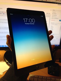 iPad held in one hand
