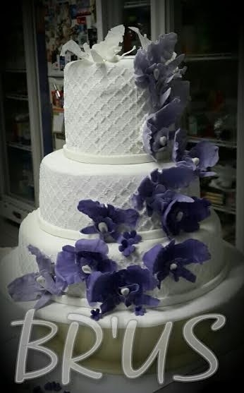 Three-Tier Wedding Cake with an Ombre Effect of Cattleya Orchid Flowers by Franc Linda of Br'US