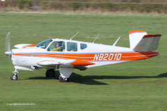 N8201D - 1957 build Beech H35 Bonanza, rolling for departure on Runway 27L at Barton
