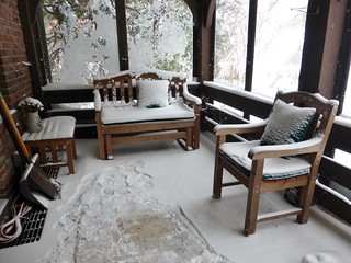 Snow on screened porch