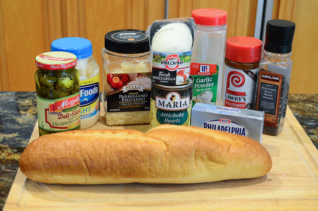 All the ingredients required for Cheesy Artichoke Bread.
