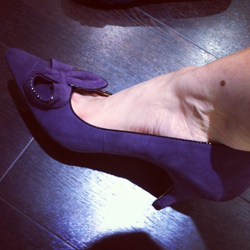 I tried on purple high heels. And I liked them. Somewhere, a pig just took flight.