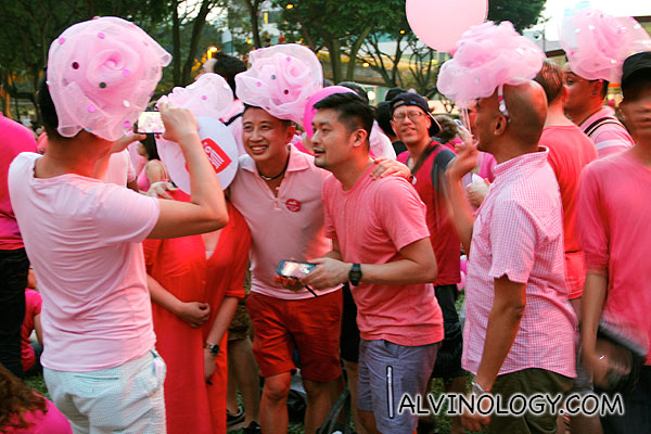 Group of guys with pink hats 