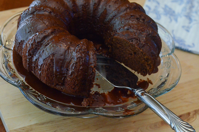 Black Russian Cake with Kahlua Glaze with a slice taken out.