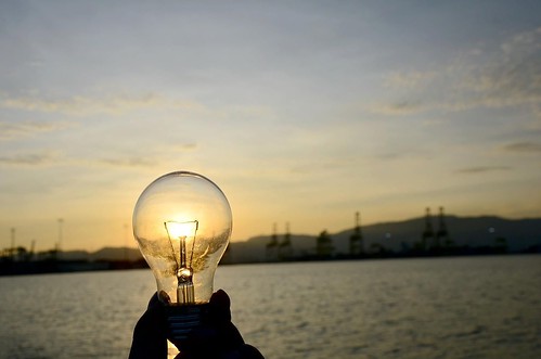 Sustainability image light bulb at sunset