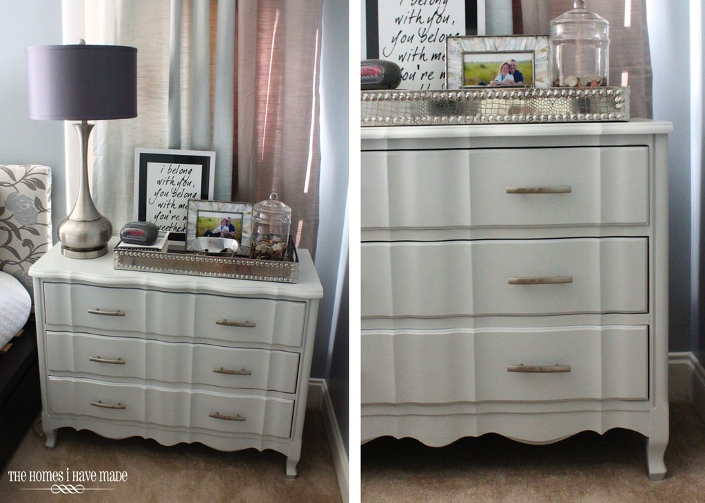 A gray dresser used as a night table