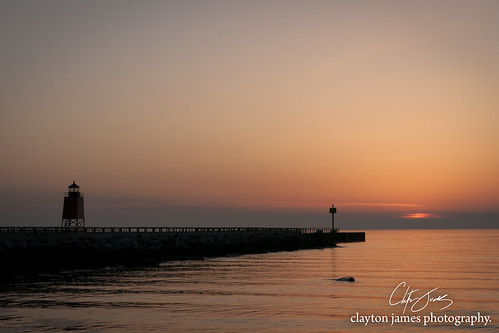 sunset lighthouse water outside pier spring michigan nopeople charlevoix