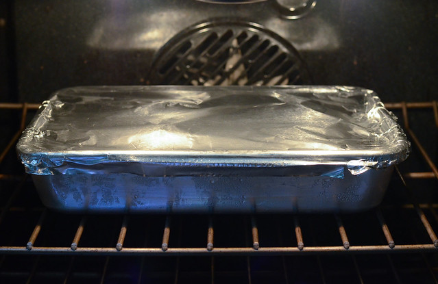 The foil lined pan is placed in the oven.