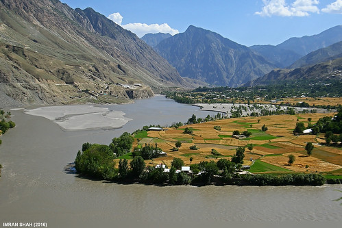 trees pakistan sky mountains building water clouds river landscape structures location elements vegetation fields greenery settlement ayun chitral kpk