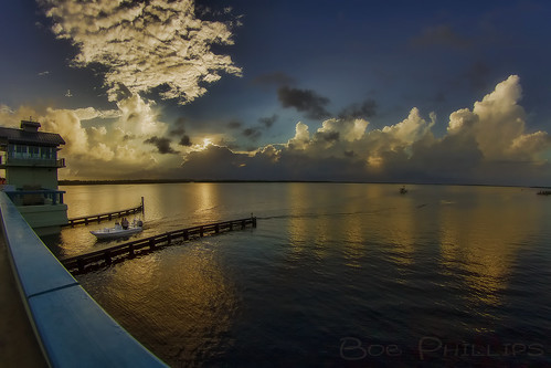 gulfofmexico clouds sunrise boat fishermen florida palmtrees drawbridge matlacha pineislandsound