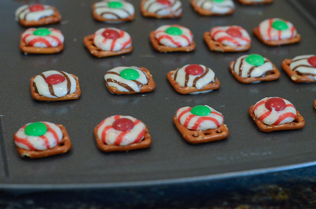 Holiday Pretzel Candies on a baking sheet after they've been baked.