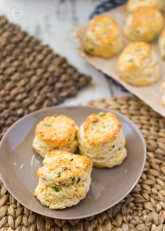 3 Garlic Cheddar Chive Scones placed on a brown plate ready to eat
