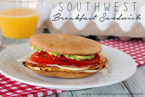 Southwest Breakfast Sandwich on a plate with a glass of orange juice.