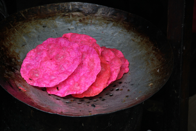 Freshly fried pink puris