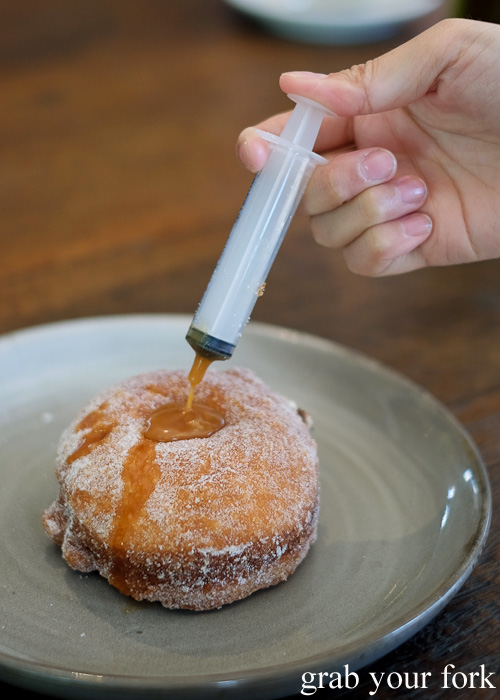 Injecting salted caramel into our donut at Blackboard Coffee, Varsity Lakes, Gold Coast