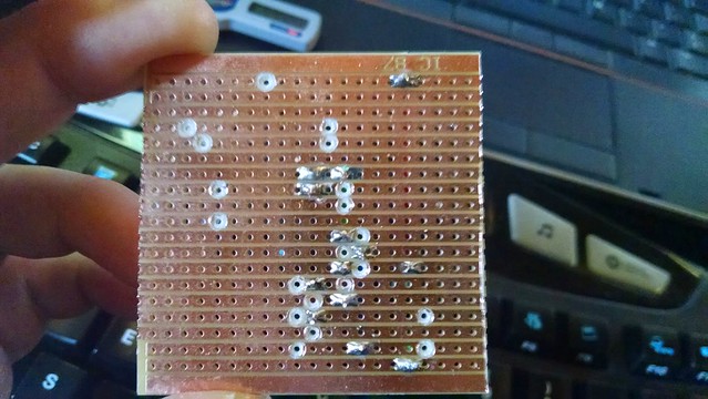 Back of cut vero board with first few solder joints