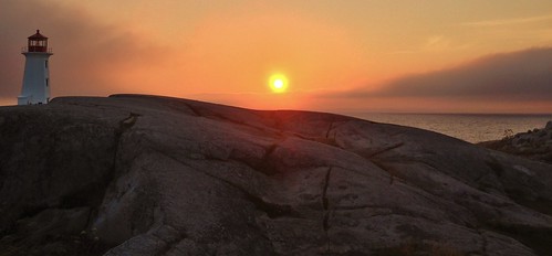 ocean old travel light sunset red sky sun lighthouse white canada building apple water rock clouds coast landscapes scenery novascotia seascapes view shoreline peaceful historic atlantic geology peggyscove atlanticocean tranquil waterscapes cellphonephoto atlanticcoast iphone5 waltphotos lordwalt