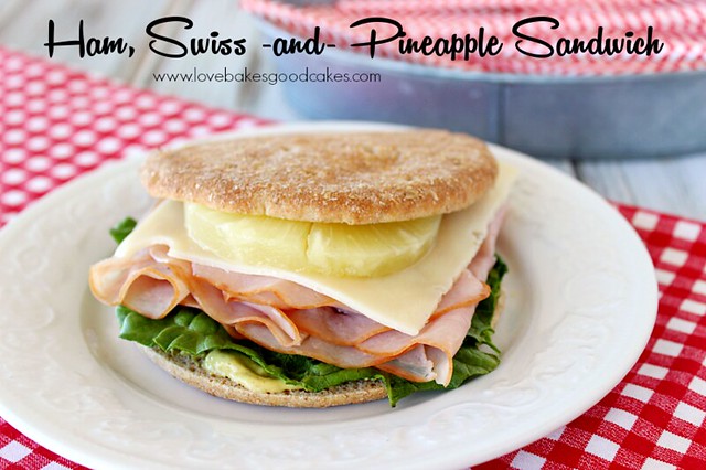 Ham, Swiss and Pineapple Sandwich on a white plate.
