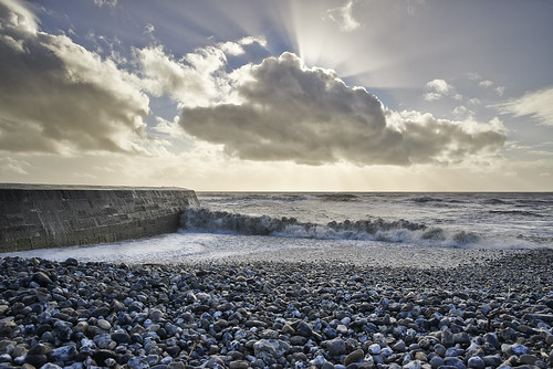 sea cloud sun beach clouds waves pebbles cobb sunrays lymeregis