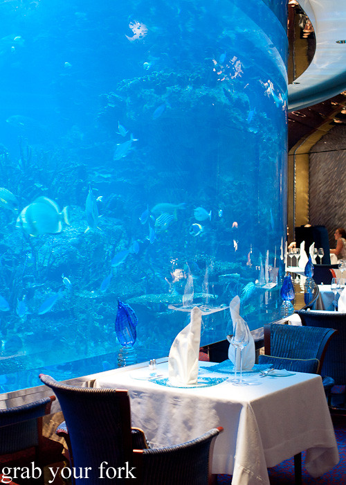 Tables by the seawater aquarium at Al Mahara  n Burj Al Arab, Dubai