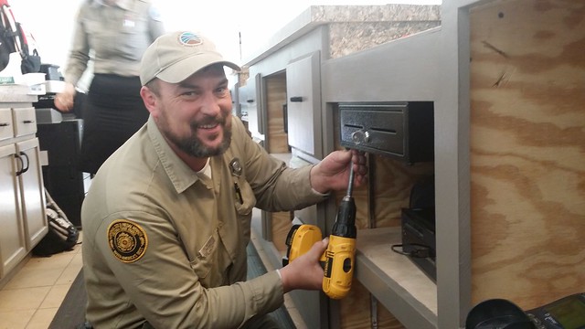 Maintenance Ranger Shawn Waldrup works on the check-in area at First Landing State Park
