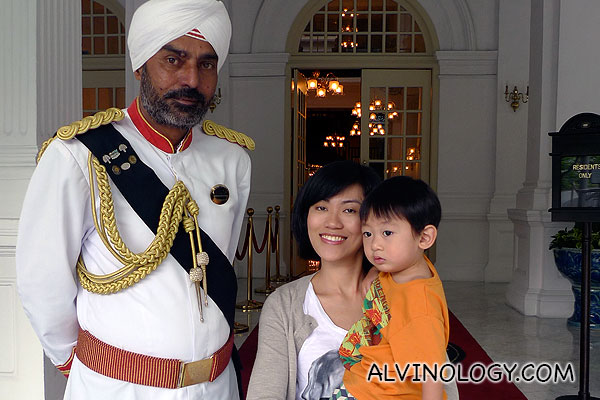 Rachel and Asher with the iconic Raffles Hotel doorman 