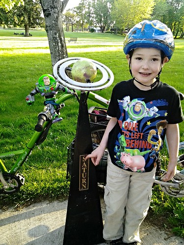 Buzz On a Bicycle and a Boy With Saturn
