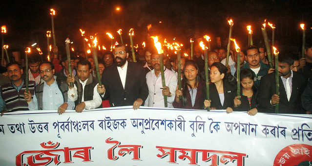 AASU activists and its leaders take out candle lit protest rally condemning the tag of 'immigrant' on Northeastern people on BJP's vision document, in Guwahati on Wednesday.