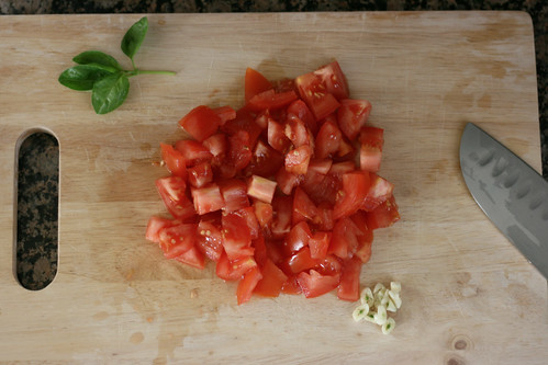 Coarsely chopped tomatoes and garlic clove