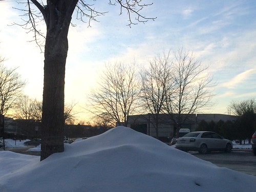 Parked by a snow drift at sunset