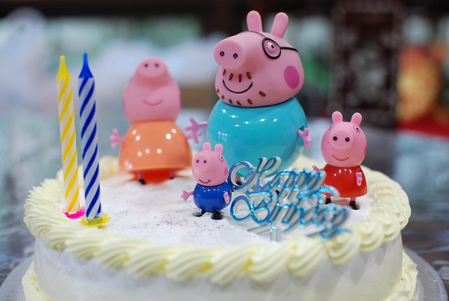 Durian cake from Jane Cake Station, decorated with Peppa Pig toys. 