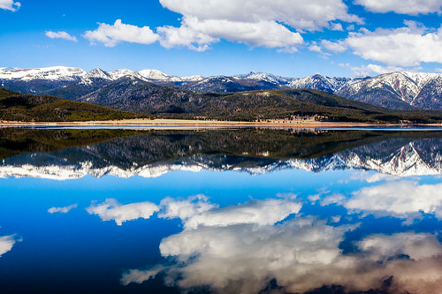 blue sky lake snow mountains reflection nature yellow clouds landscape big montana country peaceful clear reflective capped tranquil hebgen