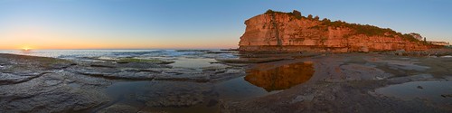 ocean sea cliff reflection sunrise dawn warm clear glowing cloudless terrigal skillion