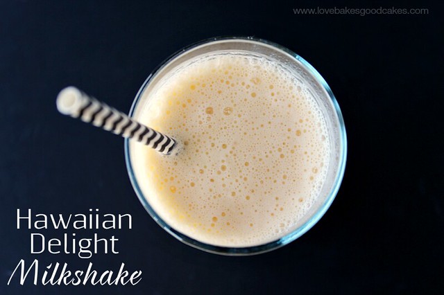 Hawaiian Delight Milkshake in a glass with a straw looking down into the glass.