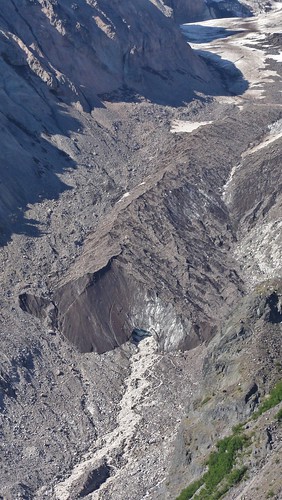 Terminus of Nisqually Glacier, with the young Nisqually River emerging.
