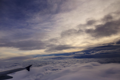sunset sky window weather clouds plane fly cloudy dusk flight wing aerial sit passengerplane passengerjet