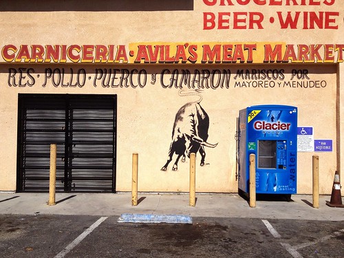 mexican grocery store butcher shop handpainted sign signpainter building wall painted art letters lettering bull artwork mural mario signs avilas meat market water glacier vending machine parking lot street view urban business cityscape landscape stocktom neighborhood carniceria toro