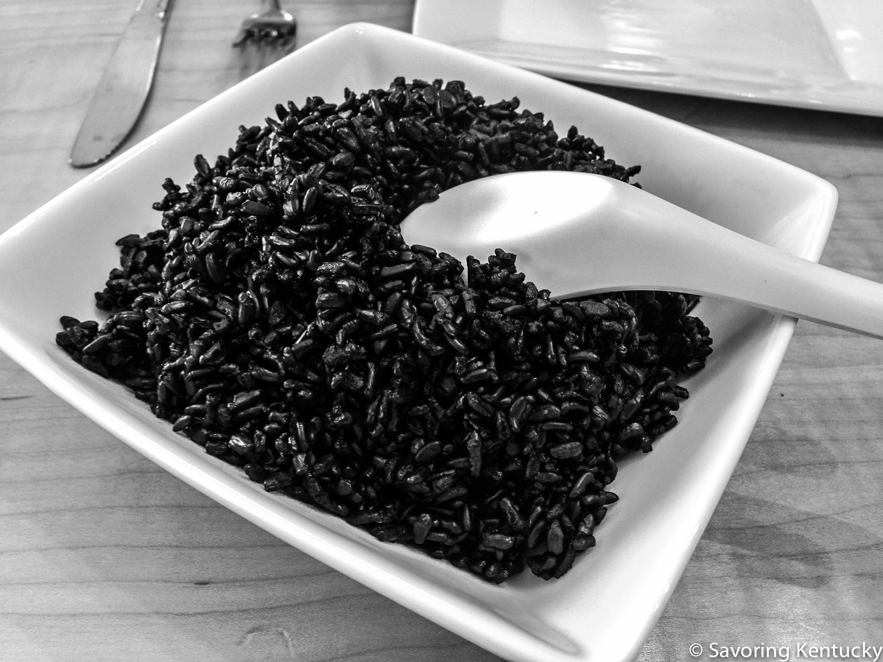 Black rice, white dish