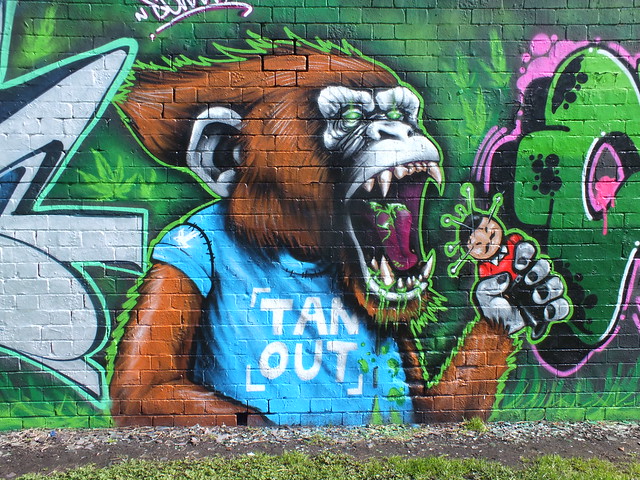 'Tan out' street art by Squid