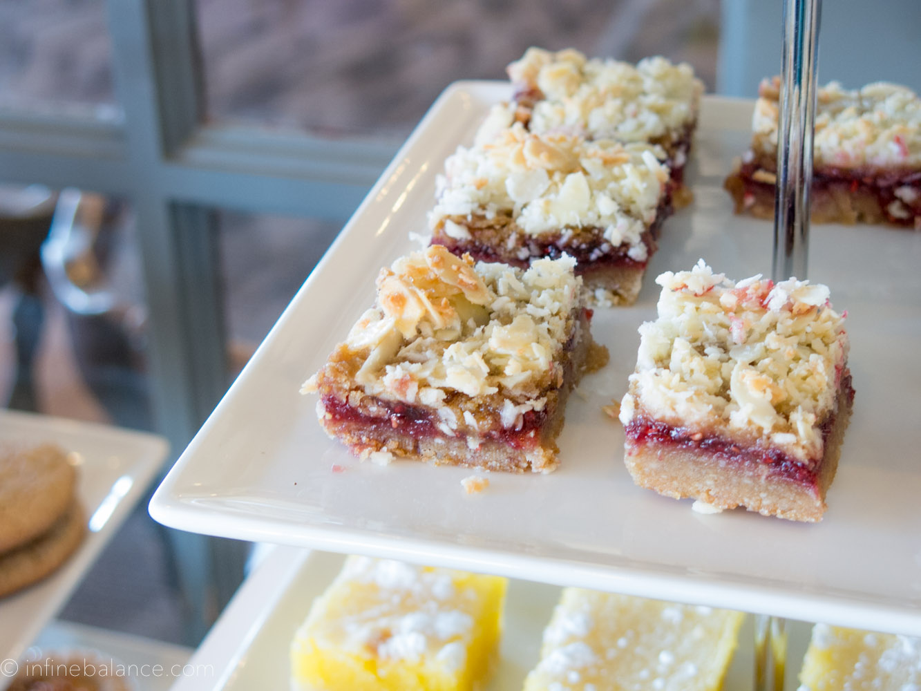 raspberry crumb bars on the sweet table at a baby shower