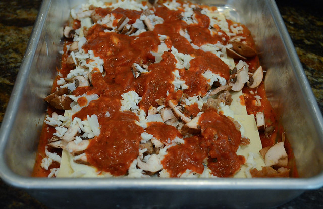 Marinara sauce is added on top of the cheese.