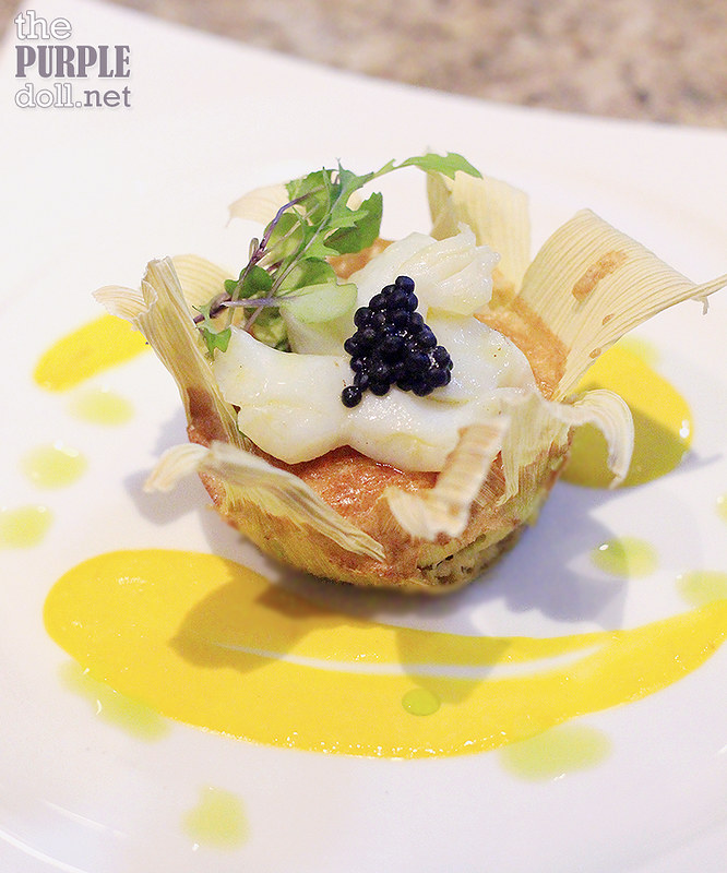 Butter-Poached Lobster Medallion, Saffron Butter Sauce on Corn Souffle Baked in Corn Husk Cup from The Terrace