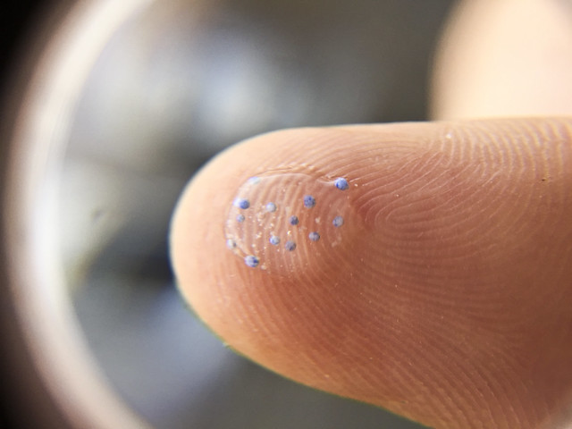 Photo of Microbeads on Fingertip