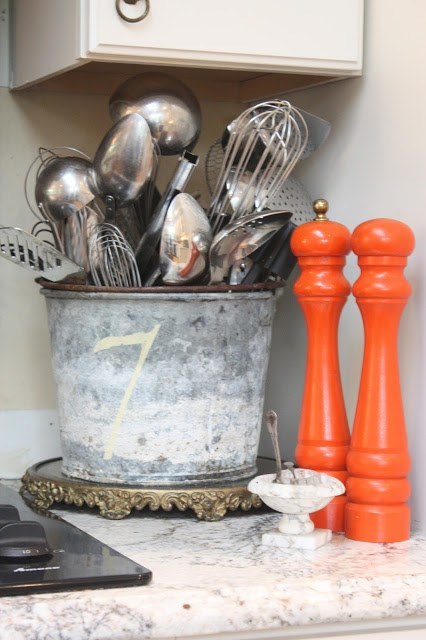 You can reuse the old pail and transform it in storage for your kitchen utensils