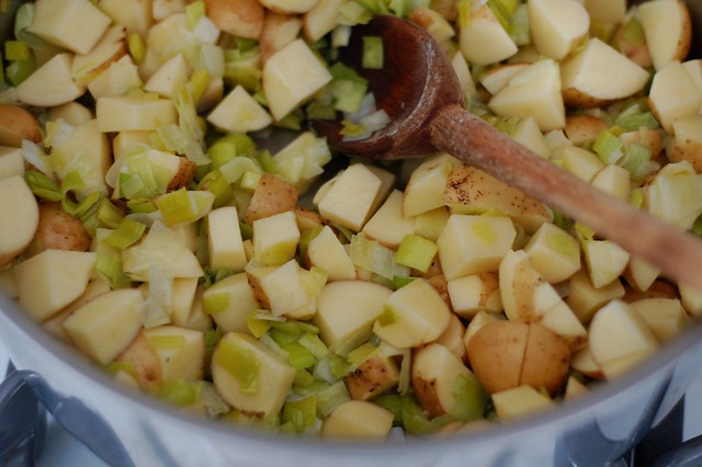 Sauteeing leeks and potatoes for the vichyssoise aka potato leek soup by Eve Fox, the Garden of Eating, copyright 2015