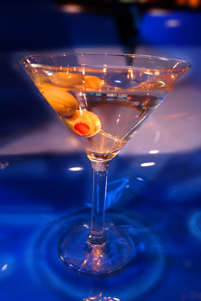 Martini with olives photograph on a blue background, photography art, for home and office décor. Title is: 143