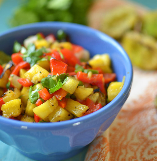 Sweet and smoky grilled pineapple salsa with charred pineapple, jalapeno, peppers and fresh herbs is perfect over grilled salmon for your summer BBQ!