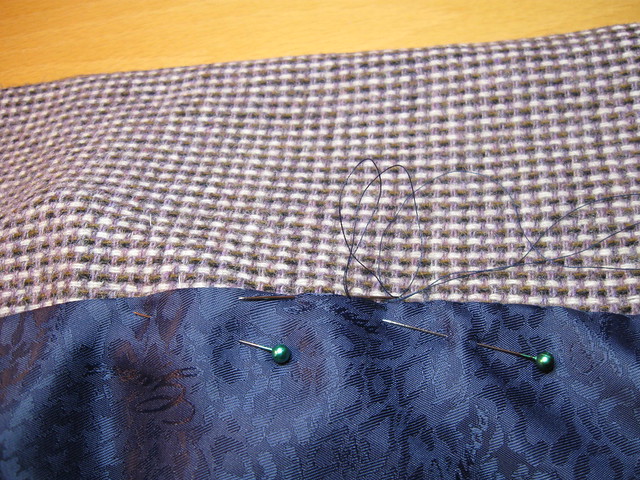 saler sewing in lining closeup