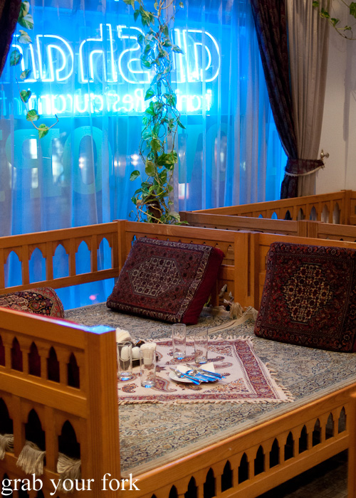 Cushion seating in an Iranian restaurant on a Frying Pan Adventures food tour in Dubai