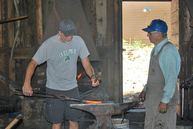 Grandpa Bolin teaches Paul how to work in the Blacksmith shop.